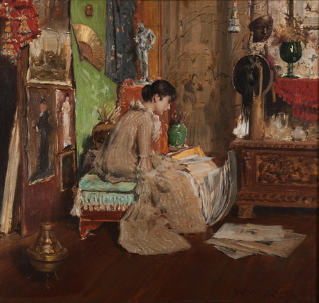 Oil painting of a woman in a striped gown sitting in profile looking through a pile of sketches. She is surrounded by the artist's studio which is full of antiques and interesting things. 