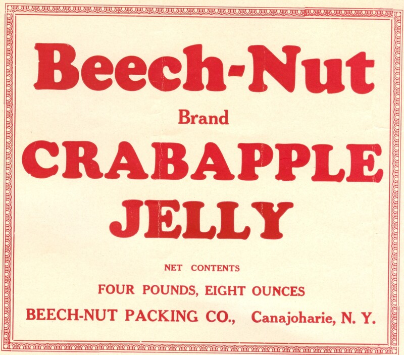 A label for a food product. Label is light red with red border. Text reads: Beech-Nut Brand Crabapple Jelly Four pounds, eight ounces, Beech-Nut Packing Co. Canajoharie N.Y. 